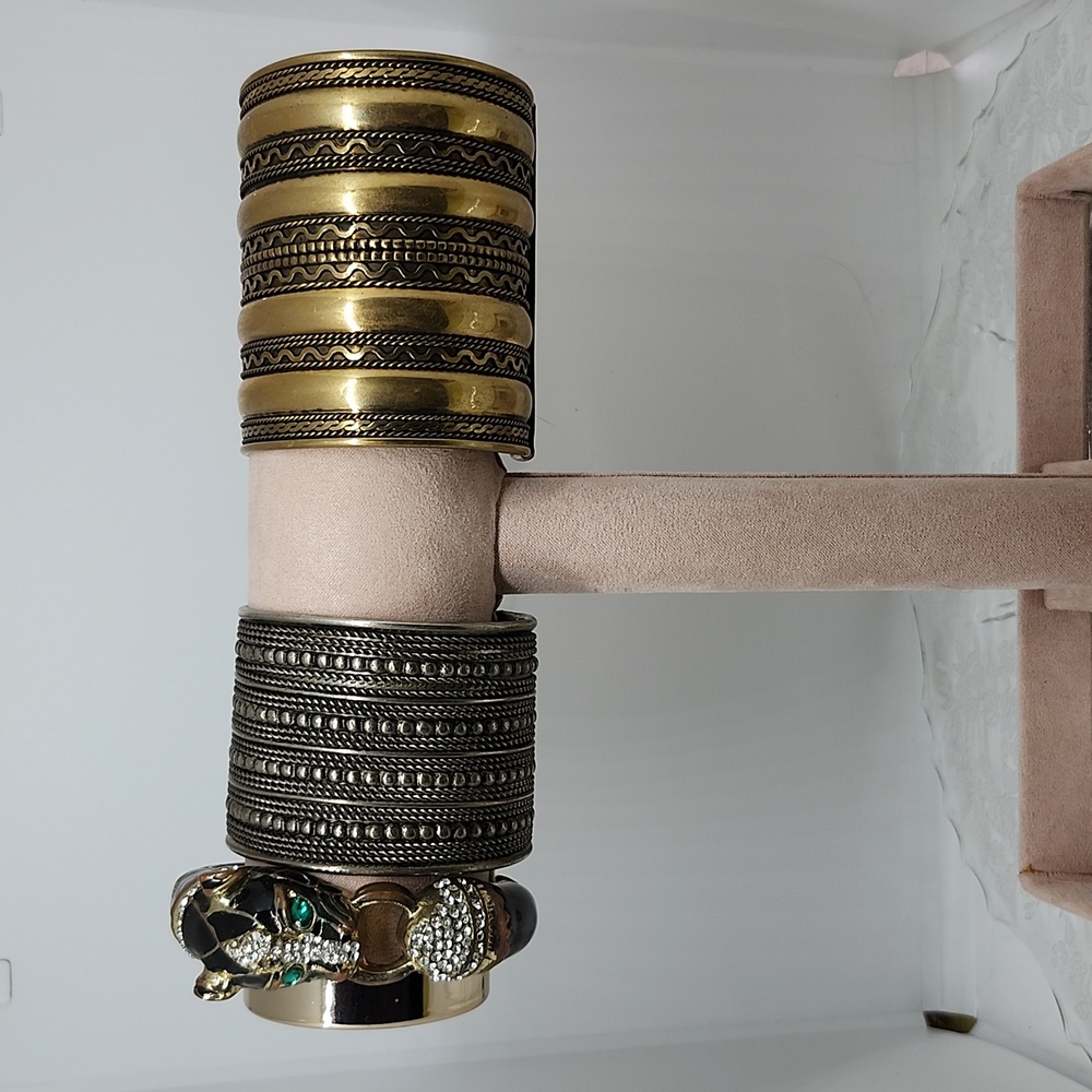 2 cuff and a clamper bracelet